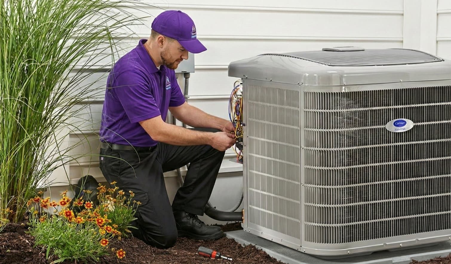 ServiStar technician servicing an AC condenser ServiStar technician servicing an AC condenser