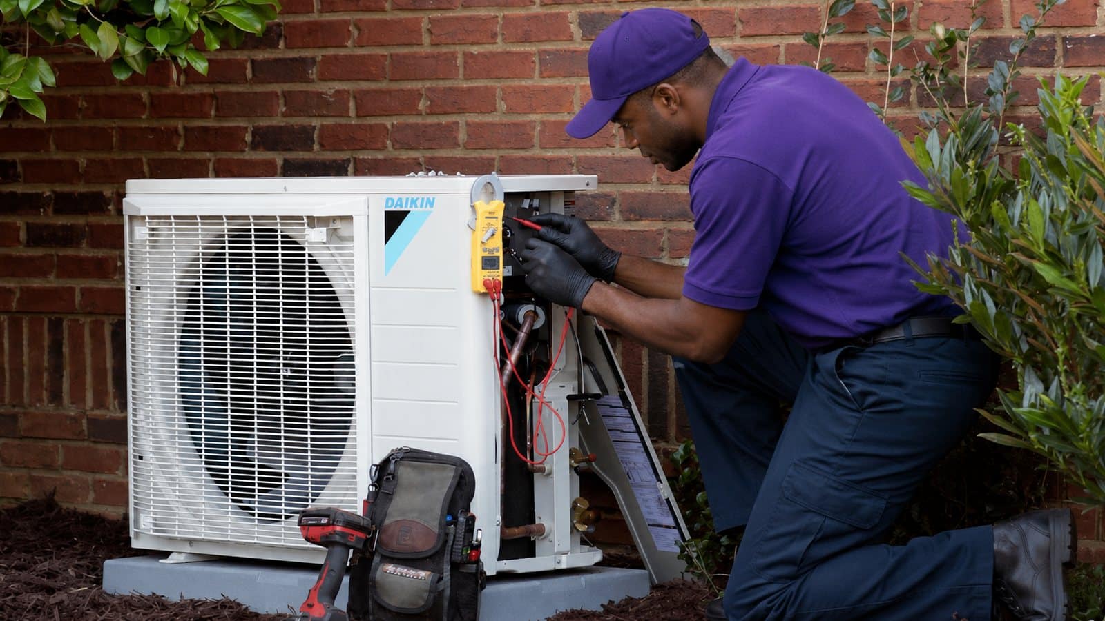 ServiStar technician installing a heat pump