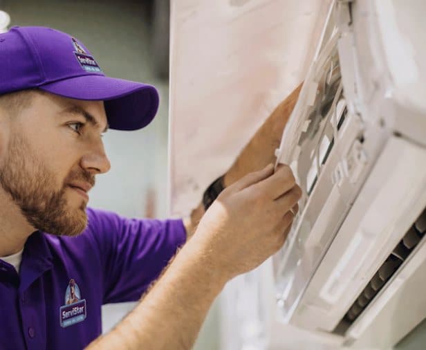 ServiStar technician installing a ductless mini split