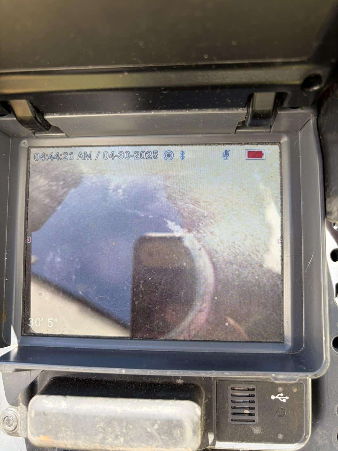 sewer pipe inspection camera monitor showing pipe interior at 30 feet